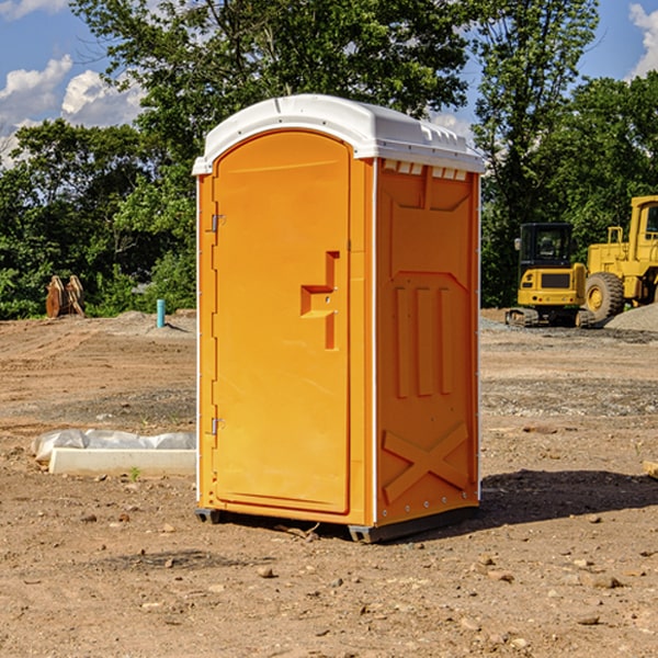 what is the cost difference between standard and deluxe portable restroom rentals in Warren